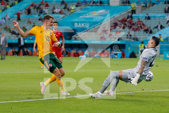 2021-06-16 - Aaron Ramsey of Wales scores his sides first goal past goalkeeper Ugurcan Cak?r of Turkey during the UEFA Euro 2020, Group A football match between Turkey and Wales on June 16, 2021 at Baku Olympic Stadium in Baku, Azerbaijan - Photo Orange Pictures / DPPI - UEFA EURO 2020, GROUP A - TURKEY VS WALES - UEFA EUROPEAN - SOCCER