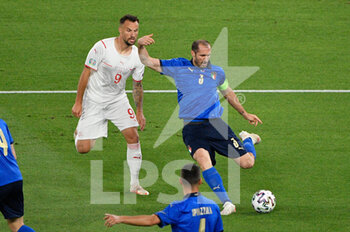 2021-06-16 - Giorgio Chiellini of Italy and Haris Seferovic of Switzerland seen in action during the UEFA Euro 2020 Group A - Italy vs Switzerland at the Olimpic Stadium in Rome. - UEFA EURO 2020 GROUP A - ITALY VS SWITZERLAND - UEFA EUROPEAN - SOCCER