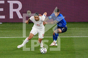 2021-06-16 - Ricardo Rodriguez of Switzerland and Giovanni Di Lorenzo of Italy seen in action during the UEFA Euro 2020 Group A - Italy vs Switzerland at the Olimpic Stadium in Rome. - UEFA EURO 2020 GROUP A - ITALY VS SWITZERLAND - UEFA EUROPEAN - SOCCER