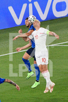 2021-06-16 - Granit Xhaka of Switzerland and Manuel Locatelli of Italy seen in action during the UEFA Euro 2020 Group A - Italy vs Switzerland at the Olimpic Stadium in Rome. - UEFA EURO 2020 GROUP A - ITALY VS SWITZERLAND - UEFA EUROPEAN - SOCCER