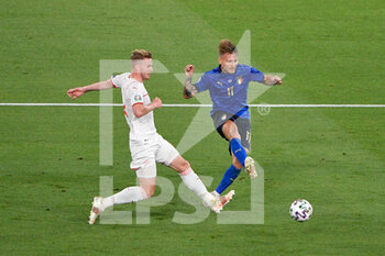 2021-06-16 - Ciro Immobile of Italy and Nico Elvedi of Switzerland seen in action during the UEFA Euro 2020 Group A - Italy vs Switzerland at the Olimpic Stadium in Rome. - UEFA EURO 2020 GROUP A - ITALY VS SWITZERLAND - UEFA EUROPEAN - SOCCER
