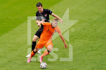 2021-06-17 - Michael Gregoritsch and Matthijs de Ligt of the Netherlands during the UEFA Euro 2020, Group C football match between Netherlands and Austria on June 17, 2021 at the Johan Cruijff ArenA in Amsterdam, Netherlands - Photo Andre Weening / Orange Pictures / DPPI - UEFA EURO 2020, GROUP C - NETHERLANDS VS AUSTRIA - UEFA EUROPEAN - SOCCER
