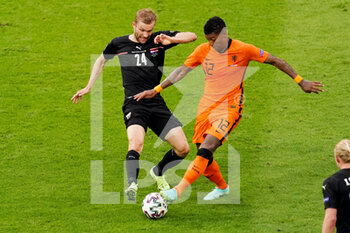 2021-06-17 - Konrad Laimer of Austria battles for possession with Patrick van Aanholt of the Netherlands during the UEFA Euro 2020, Group C football match between Netherlands and Austria on June 17, 2021 at the Johan Cruijff ArenA in Amsterdam, Netherlands - Photo Andre Weening / Orange Pictures / DPPI - UEFA EURO 2020, GROUP C - NETHERLANDS VS AUSTRIA - UEFA EUROPEAN - SOCCER