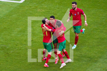 2021-06-19 - Cristiano Ronaldo of Portugal celebrates after scoring his sides first goal with Bruno Fernandes of Portugal, Diogo Jota of Portugal and Bernardo Silva of Portugal during the UEFA Euro 2020, Group F football match between Portugal and Germany on June 19, 2021 at Allianz Arena in Munich, Germany - Photo Andre Weening / Orange Pictures / DPPI - UEFA EURO 2020, GROUP F - PORTUGAL VS GERMANY - UEFA EUROPEAN - SOCCER