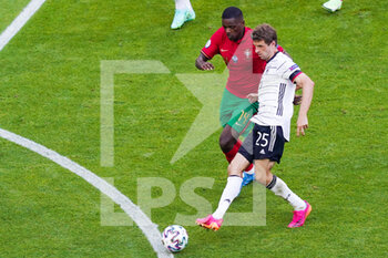 2021-06-19 - Thomas Muller of Germany and William Carvalho of Portugal during the UEFA Euro 2020, Group F football match between Portugal and Germany on June 19, 2021 at Allianz Arena in Munich, Germany - Photo Andre Weening / Orange Pictures / DPPI - UEFA EURO 2020, GROUP F - PORTUGAL VS GERMANY - UEFA EUROPEAN - SOCCER