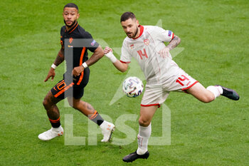 2021-06-21 - Memphis Depay of the Netherlands and Darko Velkovski of North Macedonia during the UEFA Euro 2020, Group C football match between North Macedonia and Netherlands on June 21, 2021 at the Johan Cruijff ArenA in Amsterdam, Netherlands - Photo Andre Weening / Orange Pictures / DPPI - UEFA EURO 2020, GROUP C - NORTH MACEDONIA VS NETHERLANDS - UEFA EUROPEAN - SOCCER