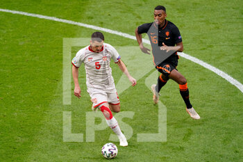2021-06-21 - Arijan Ademi of North Macedonia and Ryan Gravenberch of the Netherlands during the UEFA Euro 2020, Group C football match between North Macedonia and Netherlands on June 21, 2021 at the Johan Cruijff ArenA in Amsterdam, Netherlands - Photo Andre Weening / Orange Pictures / DPPI - UEFA EURO 2020, GROUP C - NORTH MACEDONIA VS NETHERLANDS - UEFA EUROPEAN - SOCCER