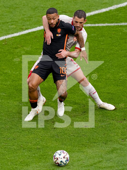 2021-06-21 - Memphis Depay of the Netherlands battle for possession with Arijan Ademi of North Macedonia during the UEFA Euro 2020, Group C football match between North Macedonia and Netherlands on June 21, 2021 at the Johan Cruijff ArenA in Amsterdam, Netherlands - Photo Andre Weening / Orange Pictures / DPPI - UEFA EURO 2020, GROUP C - NORTH MACEDONIA VS NETHERLANDS - UEFA EUROPEAN - SOCCER