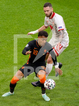 2021-06-21 - Donyell Malen of the Netherlands and Darko Velkovski of North Macedonia during the UEFA Euro 2020, Group C football match between North Macedonia and Netherlands on June 21, 2021 at the Johan Cruijff ArenA in Amsterdam, Netherlands - Photo Andre Weening / Orange Pictures / DPPI - UEFA EURO 2020, GROUP C - NORTH MACEDONIA VS NETHERLANDS - UEFA EUROPEAN - SOCCER