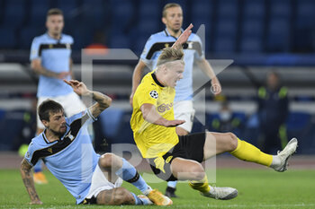 2020-10-20 - ROME, ITALY - October 20 : Francesco Acerbi ( L) of SS Lazio in action against Erling Braut Haaland (R ) of Borussia Dortmund during the UEFA Champions League group f  soccer match between SS Lazio and Borussia Dortmund Stadio Olimpico on October 20,2020 in Rome Italy - SS LAZIO VS BORUSSIA DORTMUND - UEFA CHAMPIONS LEAGUE - SOCCER