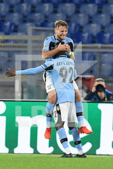 2020-10-20 - ROME, ITALY - October 20 : Ciro Immobile of SS Lazio celebrates after Jean Akpa Akpro scores a goal during the UEFA Champions League group f soccer match between SS Lazio and Borussia Dortmund at Stadio Olimpico on October 20,2020 in Rome, Italy  - SS LAZIO VS BORUSSIA DORTMUND - UEFA CHAMPIONS LEAGUE - SOCCER