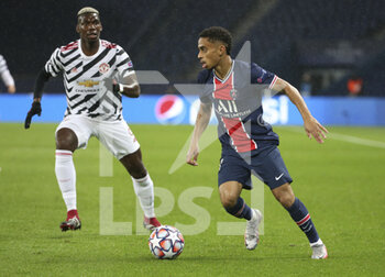 2020-10-20 - Colin Dagba of PSG, Paul Pogba of Manchester United (left) during the UEFA Champions League, Group Stage, Group H football match between Paris Saint-Germain (PSG) and Manchester United (Man U) on October 20, 2020 at Parc des Princes stadium in Paris, France - Photo Jean Catuffe / DPPI - PARIS SAINT-GERMAIN (PSG) VS MANCHESTER UNITED (MAN U) - UEFA CHAMPIONS LEAGUE - SOCCER
