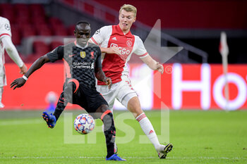 2020-10-21 - Sadio Mane of Liverpool FC, Perr Schuurs of Ajax during the UEFA Champions League, Group Stage, Group D football match between Ajax and Liverpool on October 21, 2020 at Johan Cruijff ArenA in Amsterdam, Netherlands - Photo Gerrit van Keulen / Orange Pictures / DPPI - AJAX VS LIVERPOOL - UEFA CHAMPIONS LEAGUE - SOCCER