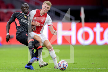 2020-10-21 - Sadio Mane of Liverpool FC, Perr Schuurs of Ajax during the UEFA Champions League, Group Stage, Group D football match between Ajax and Liverpool on October 21, 2020 at Johan Cruijff ArenA in Amsterdam, Netherlands - Photo Gerrit van Keulen / Orange Pictures / DPPI - AJAX VS LIVERPOOL - UEFA CHAMPIONS LEAGUE - SOCCER