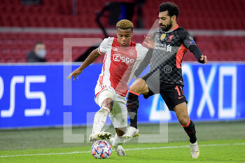 2020-10-21 - David Neres of Ajax, Mohamed Salah of Liverpool FC during the UEFA Champions League, Group Stage, Group D football match between Ajax and Liverpool on October 21, 2020 at Johan Cruijff ArenA in Amsterdam, Netherlands - Photo Gerrit van Keulen / Orange Pictures / DPPI -  AJAX VS LIVERPOOL - UEFA CHAMPIONS LEAGUE - SOCCER