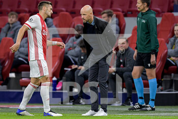 2020-10-21 - Dusan Tadic of Ajax and Head Coach Erik Ten Hag of Ajax during the UEFA Champions League, Group Stage, Group D football match between Ajax and Liverpool on October 21, 2020 at Johan Cruijff ArenA in Amsterdam, Netherlands - Photo Gerrit van Keulen / Orange Pictures / DPPI -  AJAX VS LIVERPOOL - UEFA CHAMPIONS LEAGUE - SOCCER