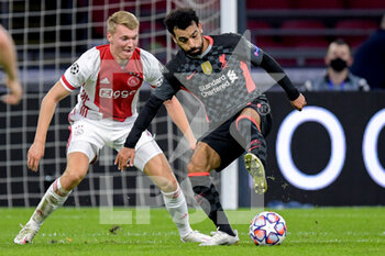 2020-10-21 - Perr Schuurs of Ajax, Mohamed Salah of Liverpool FC during the UEFA Champions League, Group Stage, Group D football match between Ajax and Liverpool on October 21, 2020 at Johan Cruijff ArenA in Amsterdam, Netherlands - Photo Gerrit van Keulen / Orange Pictures / DPPI -  AJAX VS LIVERPOOL - UEFA CHAMPIONS LEAGUE - SOCCER