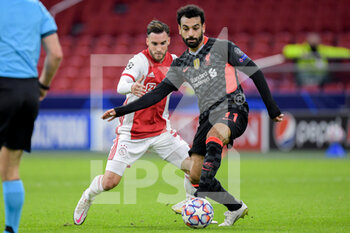 2020-10-21 - Nicolas Tagliafico of Ajax, Mohamed Salah of Liverpool FC during the UEFA Champions League, Group Stage, Group D football match between Ajax and Liverpool on October 21, 2020 at Johan Cruijff ArenA in Amsterdam, Netherlands - Photo Gerrit van Keulen / Orange Pictures / DPPI -  AJAX VS LIVERPOOL - UEFA CHAMPIONS LEAGUE - SOCCER