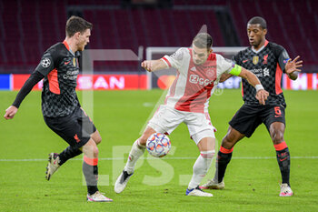 2020-10-21 - Andrew Robertson of Liverpool FC, Dusan Tadic of Ajax, Georginio Wijnaldum of Liverpool FC during the UEFA Champions League, Group Stage, Group D football match between Ajax and Liverpool on October 21, 2020 at Johan Cruijff ArenA in Amsterdam, Netherlands - Photo Gerrit van Keulen / Orange Pictures / DPPI -  AJAX VS LIVERPOOL - UEFA CHAMPIONS LEAGUE - SOCCER
