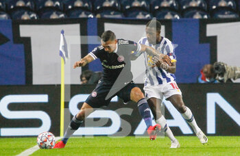 2020-10-27 - Jose Holebas of Olympiacos (L) in action with Wilson Manafa of Porto during the UEFA Champions League, Group Stage, Group C football match between FC Porto and Olympiacos on October 27, 2020 at Estadio do Dragao in Porto, Portugal - Photo Nuno Guimaraes / ProSportsImages / DPPI - FC PORTO VS OLYMPIACOS - UEFA CHAMPIONS LEAGUE - SOCCER