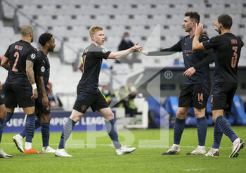 2020-10-27 - Kevin de Bruyne of Manchester City celebrates the first goal with Aymeric Laporte, Ruben Dias during the UEFA Champions League, Group Stage, Group C football match between Olympique de Marseille and Manchester City on October 27, 2020 at Orange Velodrome stadium in Marseille, France - Photo Jean Catuffe / DPPI - OLYMPIQUE DE MARSEILLE VS MANCHESTER CITY - UEFA CHAMPIONS LEAGUE - SOCCER