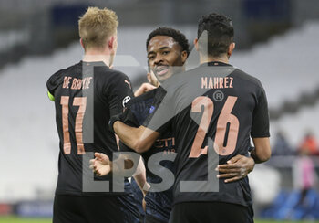 2020-10-27 - Kevin de Bruyne of Manchester City celebrates his goal with Raheem Sterling (center), Riyad Mahrez during the UEFA Champions League, Group Stage, Group C football match between Olympique de Marseille and Manchester City on October 27, 2020 at Orange Velodrome stadium in Marseille, France - Photo Jean Catuffe / DPPI - OLYMPIQUE DE MARSEILLE VS MANCHESTER CITY - UEFA CHAMPIONS LEAGUE - SOCCER
