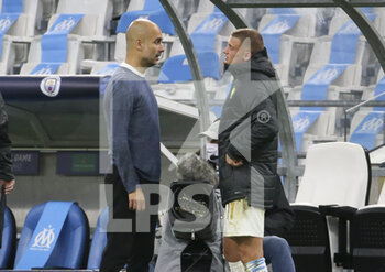 2020-10-27 - Coach of Manchester City Pep Guardiola talks to Michael Cuisance of Marseille following the UEFA Champions League, Group Stage, Group C football match between Olympique de Marseille and Manchester City on October 27, 2020 at Orange Velodrome stadium in Marseille, France - Photo Jean Catuffe / DPPI - OLYMPIQUE DE MARSEILLE VS MANCHESTER CITY - UEFA CHAMPIONS LEAGUE - SOCCER