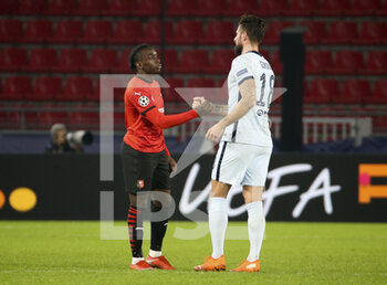 2020-11-24 - Jeremy Doku of Stade Rennais, Olivier Giroud of Chelsea following the UEFA Champions League, Group E football match between Stade Rennais and Chelsea on November 24, 2020 at Roazhon Park in Rennes, France - Photo Jean Catuffe / DPPI - STADE RENNAIS VS CHELSEA - UEFA CHAMPIONS LEAGUE - SOCCER