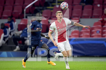 2020-11-25 - Awer Mabil of FC Midtjylland, Perr Schuurs of Ajax during the UEFA Champions League, Group D football match between Ajax and Midtjylland on november 25, 2020 at Johan Cruijff Arena in Amsterdam, Netherlands - Photo Gerrit van Keulen / Orange Pictures / DPPI - AJAX VS MIDTJYLLAND - UEFA CHAMPIONS LEAGUE - SOCCER