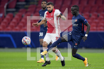 2020-11-25 - Zakaria Labyad of Ajax, Awer Mabil of FC Midtjylland during the UEFA Champions League, Group D football match between Ajax and Midtjylland on november 25, 2020 at Johan Cruijff Arena in Amsterdam, Netherlands - Photo Gerrit van Keulen / Orange Pictures / DPPI - AJAX VS MIDTJYLLAND - UEFA CHAMPIONS LEAGUE - SOCCER