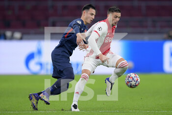 2020-11-25 - Dion Cools of FC Midtjylland, Dusan Tadic of Ajax during the UEFA Champions League, Group D football match between Ajax and Midtjylland on november 25, 2020 at Johan Cruijff Arena in Amsterdam, Netherlands - Photo Gerrit van Keulen / Orange Pictures / DPPI - AJAX VS MIDTJYLLAND - UEFA CHAMPIONS LEAGUE - SOCCER