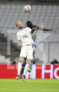 2020-11-25 - Valere Germain of Marseille, Malang Sarr of Porto during the UEFA Champions League, Group C football match between Olympique de Marseille and FC Porto on November 25, 2020 at Orange Velodrome stadium in Marseille, France - Photo Jean Catuffe / DPPI - OLYMPIQUE DE MARSEILLE VS FC PORTO - UEFA CHAMPIONS LEAGUE - SOCCER