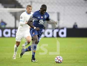 2020-11-25 - Malang Sarr of Porto, Michael Cuisance of Marseille (left) during the UEFA Champions League, Group C football match between Olympique de Marseille and FC Porto on November 25, 2020 at Orange Velodrome stadium in Marseille, France - Photo Jean Catuffe / DPPI - OLYMPIQUE DE MARSEILLE VS FC PORTO - UEFA CHAMPIONS LEAGUE - SOCCER