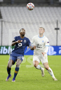 2020-11-25 - Wilson Manafa of Porto, Michael Cuisance of Marseille during the UEFA Champions League, Group C football match between Olympique de Marseille and FC Porto on November 25, 2020 at Orange Velodrome stadium in Marseille, France - Photo Jean Catuffe / DPPI - OLYMPIQUE DE MARSEILLE VS FC PORTO - UEFA CHAMPIONS LEAGUE - SOCCER