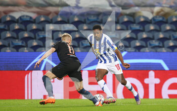 2020-12-01 - Wilson Manafa of Porto (R) in action with Manchester City defender Oleksandr Zinchenko during the UEFA Champions League, Group C football match between FC Porto and Manchester City on December 1, 2020 at Estadio do Dragao in Porto, Portugal - Photo Nuno Guimaraes / ProSportsImages / DPPI - FC PORTO VS MANCHESTER CITY - UEFA CHAMPIONS LEAGUE - SOCCER
