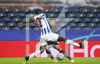 2020-12-01 - Malang Sarr of Porto (L) in action with Manchester City defender Joao Cancelo during the UEFA Champions League, Group C football match between FC Porto and Manchester City on December 1, 2020 at Estadio do Dragao in Porto, Portugal - Photo Nuno Guimaraes / ProSportsImages / DPPI - FC PORTO VS MANCHESTER CITY - UEFA CHAMPIONS LEAGUE - SOCCER