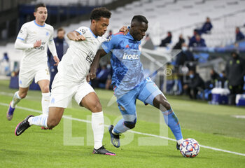 2020-12-01 - Mady Camara of Olympiacos, Boubacar Kamara of Marseille (left) during the UEFA Champions League, Group C football match between Olympique de Marseille (OM) and Olympiacos FC (Olympiakos) on December 1, 2020 at Stade Velodrome in Marseille, France - Photo Jean Catuffe / DPPI - OLYMPIQUE DE MARSEILLE VS OLYMPIACOS FC - UEFA CHAMPIONS LEAGUE - SOCCER