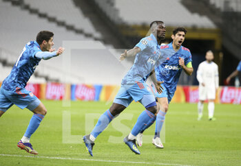 2020-12-01 - Mady Camara of Olympiacos celebrates his goal during the UEFA Champions League, Group C football match between Olympique de Marseille (OM) and Olympiacos FC (Olympiakos) on December 1, 2020 at Stade Velodrome in Marseille, France - Photo Jean Catuffe / DPPI - OLYMPIQUE DE MARSEILLE VS OLYMPIACOS FC - UEFA CHAMPIONS LEAGUE - SOCCER