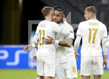 2020-12-01 - Dimitri Payet of Marseille celebrates his first goal on a penalty kick with Valentin Rongier (left) and teammates during the UEFA Champions League, Group C football match between Olympique de Marseille (OM) and Olympiacos FC (Olympiakos) on December 1, 2020 at Stade Velodrome in Marseille, France - Photo Jean Catuffe / DPPI - OLYMPIQUE DE MARSEILLE VS OLYMPIACOS FC - UEFA CHAMPIONS LEAGUE - SOCCER