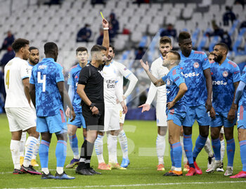 2020-12-01 - Referee Jesus Gil Manzano of Spain gives a yellow card to Rafinha aka Marcio Rafael Ferreira de Souza of Olympiacos and a penalty for Marseille during the UEFA Champions League, Group C football match between Olympique de Marseille (OM) and Olympiacos FC (Olympiakos) on December 1, 2020 at Stade Velodrome in Marseille, France - Photo Jean Catuffe / DPPI - OLYMPIQUE DE MARSEILLE VS OLYMPIACOS FC - UEFA CHAMPIONS LEAGUE - SOCCER