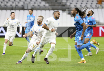 2020-12-01 - Dimitri Payet of Marseille celebrates his second goal on a penalty kick with Valere Germain (left) during the UEFA Champions League, Group C football match between Olympique de Marseille (OM) and Olympiacos FC (Olympiakos) on December 1, 2020 at Stade Velodrome in Marseille, France - Photo Jean Catuffe / DPPI - OLYMPIQUE DE MARSEILLE VS OLYMPIACOS FC - UEFA CHAMPIONS LEAGUE - SOCCER
