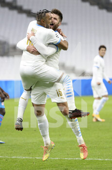 2020-12-01 - Dimitri Payet of Marseille celebrates his second goal on a penalty kick with Duje Caleta-Car during the UEFA Champions League, Group C football match between Olympique de Marseille (OM) and Olympiacos FC (Olympiakos) on December 1, 2020 at Stade Velodrome in Marseille, France - Photo Jean Catuffe / DPPI - OLYMPIQUE DE MARSEILLE VS OLYMPIACOS FC - UEFA CHAMPIONS LEAGUE - SOCCER