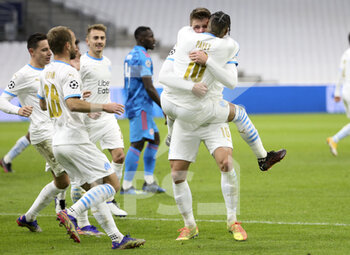 2020-12-01 - Dimitri Payet of Marseille celebrates his second goal on a penalty kick with Duje Caleta-Car and teammates during the UEFA Champions League, Group C football match between Olympique de Marseille (OM) and Olympiacos FC (Olympiakos) on December 1, 2020 at Stade Velodrome in Marseille, France - Photo Jean Catuffe / DPPI - OLYMPIQUE DE MARSEILLE VS OLYMPIACOS FC - UEFA CHAMPIONS LEAGUE - SOCCER