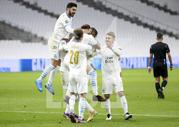 2020-12-01 - Dimitri Payet of Marseille celebrates his second goal on a penalty kick with Morgan Sanson (left) and teammates during the UEFA Champions League, Group C football match between Olympique de Marseille (OM) and Olympiacos FC (Olympiakos) on December 1, 2020 at Stade Velodrome in Marseille, France - Photo Jean Catuffe / DPPI - OLYMPIQUE DE MARSEILLE VS OLYMPIACOS FC - UEFA CHAMPIONS LEAGUE - SOCCER