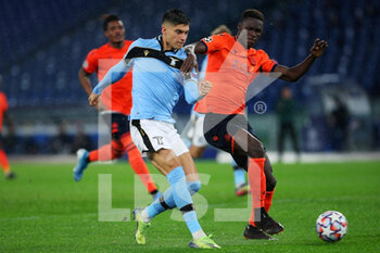 2020-12-08 - Joaquin Correa of Lazio (L) vies for the ball with Odilon Kossounou of Club Brugge (R) during the UEFA Champions League, Group F football match between SS Lazio and Club Brugge KV on December 8, 2020 at Stadio Olimpico in Rome, Italy - Photo Federico Proietti / DPPI - SS LAZIO VS CLUB BRUGGE KV - UEFA CHAMPIONS LEAGUE - SOCCER