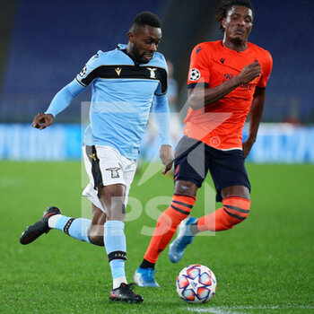 2020-12-08 - Jean Daniel Akpa Akpro of Lazio (L) vies for the ball with Simon Deliduring of Club Brugge (R) the UEFA Champions League, Group F football match between SS Lazio and Club Brugge KV on December 8, 2020 at Stadio Olimpico in Rome, Italy - Photo Federico Proietti / DPPI - SS LAZIO VS CLUB BRUGGE KV - UEFA CHAMPIONS LEAGUE - SOCCER
