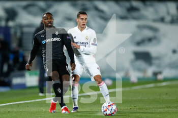 2020-12-09 - Marcus Thuram of Monchengladbach and Lucas Vazquez of Real Madrid in action during the UEFA Champions League, Group B football match between Real Madrid and Borussia Monchengladbach on december 9, 2020 at Ciudad Deportiva Real Madrid in Valdebebas, Madrid, Spain - Photo Oscar J Barroso / Spain DPPI / DPPI - REAL MADRID VS BORUSSIA MONCHENGLADBACH - UEFA CHAMPIONS LEAGUE - SOCCER
