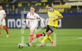 2021-03-09 - Ivan Rakitic of FC Sevilla and Emre Can of Borussia Dortmund during the UEFA Champions League, round of 16, 2nd leg football match between Borussia Dortmund and FC Sevilla on March 9, 2021 at Signal Iduna Park in Dortmund, Germany - Photo Jurgen Fromme / firo sportphoto / DPPI - BORUSSIA DORTMUND AND FC SEVILLA - UEFA CHAMPIONS LEAGUE - SOCCER