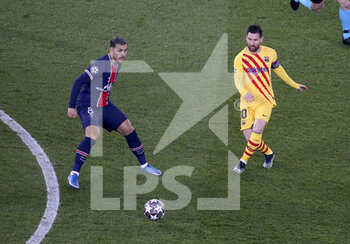 2021-03-10 - Lionel Messi of Barcelona, Leandro Paredes of PSG (left) during the UEFA Champions League, round of 16, 2nd leg football match between Paris Saint-Germain (PSG) and FC Barcelona (Barca) on March 10, 2021 at Parc des Princes stadium in Paris, France - Photo Jean Catuffe / DPPI - PARIS SAINT-GERMAIN (PSG) AND FC BARCELONA (BARCA) - UEFA CHAMPIONS LEAGUE - SOCCER
