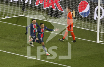 2021-03-10 - Kylian Mbappe of PSG celebrates his goal on a penalty kick with Alessandro Florenzi while goalkeeper of Barcelona Marc-Andre ter Stegen looks on during the UEFA Champions League, round of 16, 2nd leg football match between Paris Saint-Germain (PSG) and FC Barcelona (Barca) on March 10, 2021 at Parc des Princes stadium in Paris, France - Photo Jean Catuffe / DPPI - PARIS SAINT-GERMAIN (PSG) AND FC BARCELONA (BARCA) - UEFA CHAMPIONS LEAGUE - SOCCER